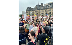 Roughly a thousand farmers and rural landowners rallied outside Parliament on June 10 to demand a moratorium on Alto's high-speed rail line, arguing the project would carve up Quebec and Ontario farmland with too little transparency, even as the Crown corporation behind it touts a tourism and economic windfall worth billions. Photo: Vincent Yergeau